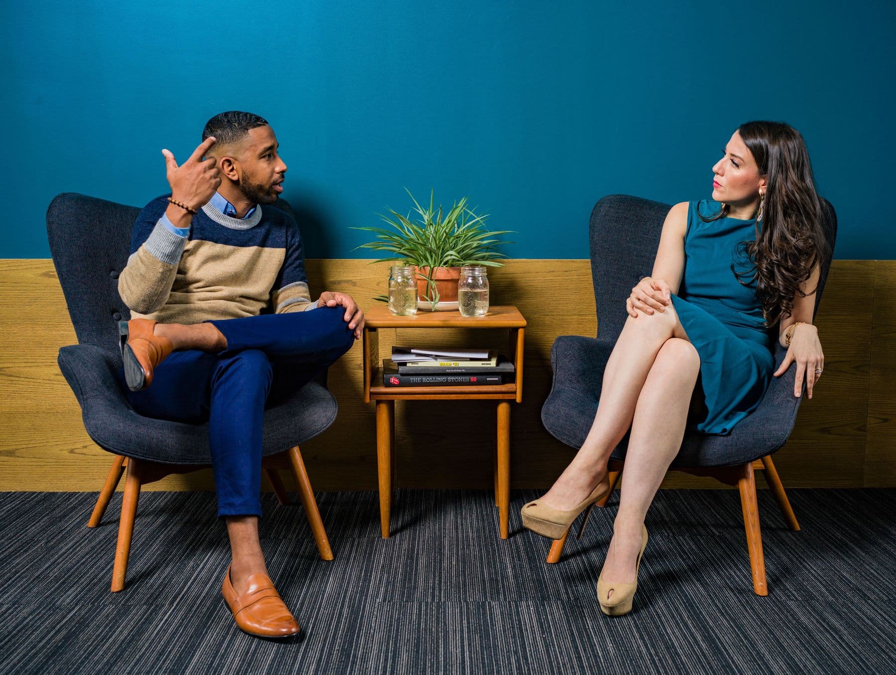 Therapist and client talking in chairs during a counseling session