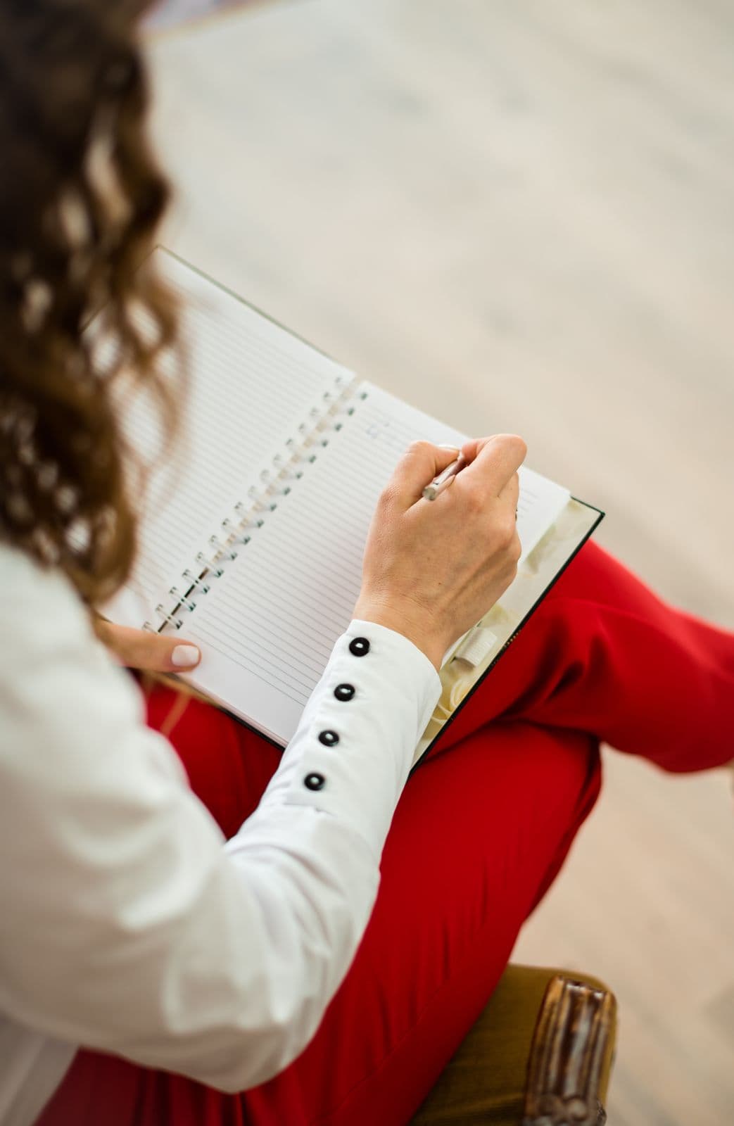 Woman writing in a journal