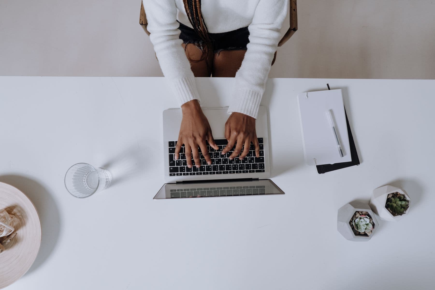 Laptop on a bright desk, ready for an online therapy session
